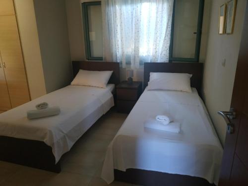 two beds sitting next to each other in a room at Villa Sofia with an amazing view in Angón
