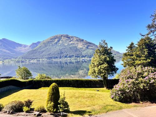 a view of a lake with a mountain in the background at Allt Nan Ros Apartments fort william in Onich