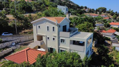 a house on a hill with red roofs at Villa Sofia with an amazing view in Angón
