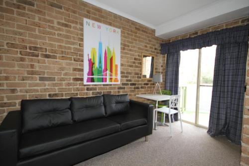 Zona de estar de Acacia Snowy Motel