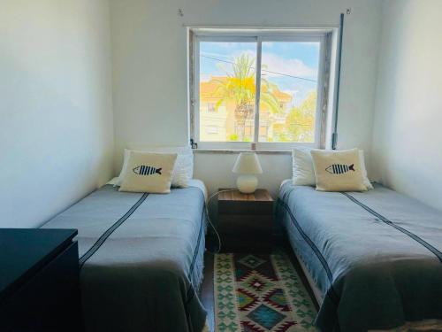 Ένα ή περισσότερα κρεβάτια σε δωμάτιο στο Peaceful 2 bd in Monte Estoril