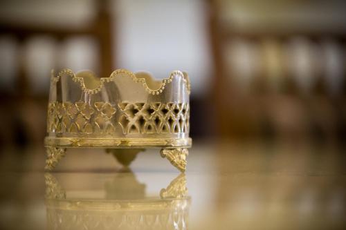 a gold chair sitting on a table at Jawi Peranakan Mansion in George Town