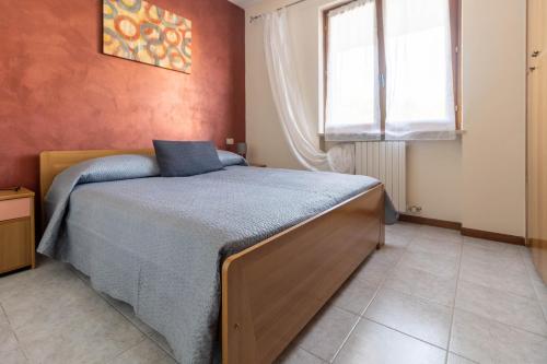 Postel nebo postele na pokoji v ubytování ERNY9 By Case al Lago