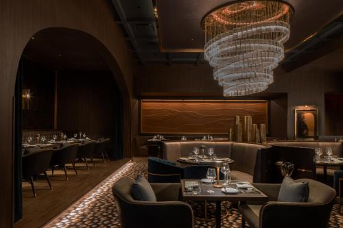 a dining room with tables and a chandelier at Live Casino & Hotel - Louisiana in Bossier City