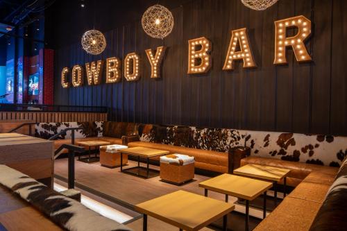 a restaurant with a happy bar sign on the wall at Live Casino & Hotel - Louisiana in Bossier City