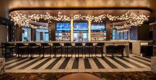 a bar in a hotel with chandeliers at Live Casino & Hotel - Louisiana in Bossier City