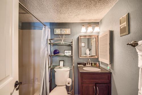 a bathroom with a toilet and a sink and a shower at Riverpalooza RRC A305 in New Braunfels