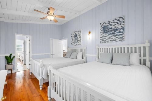 a bedroom with two beds and a ceiling fan at Channel Vibes in Myrtle Beach