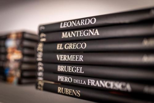 a stack of books stacked on top of each other at Tosti 79 in Formia