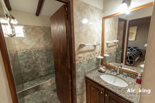 a bathroom with a sink and a shower at Cabañas familiares in Tafí del Valle
