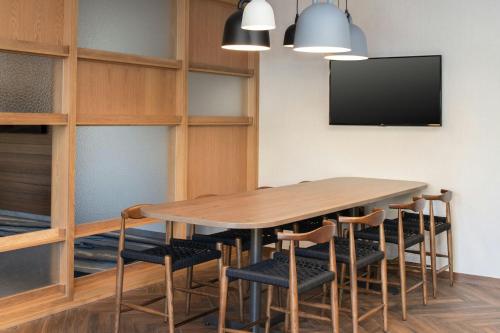 a conference room with a wooden table and chairs at Fairfield by Marriott Inn & Suites Scottsdale Old Town in Scottsdale