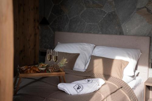 a bedroom with a bed with a table with towels on it at Gorczański Lux Chalet in Szlembark