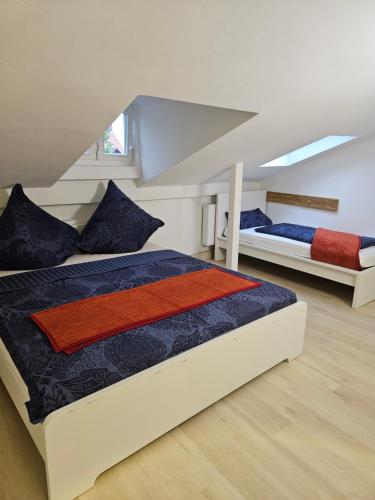a bedroom with two beds in a attic at Olymp 6-8 in Bamberg