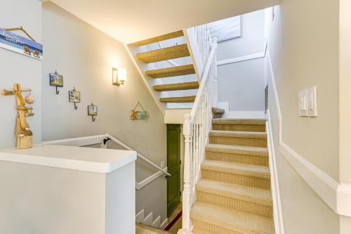 a white staircase in a home with white railings at Walk to Beach Coligny Gem with Community Perks! in Hilton Head Island