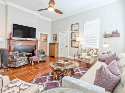 a living room with a couch and a table at Habersham 2 in Savannah