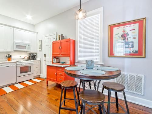 a kitchen with a table and four chairs in it at Habersham 2 in Savannah