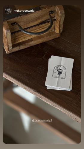 a small box sitting on a wooden table at Gorczański Lux Chalet in Szlembark
