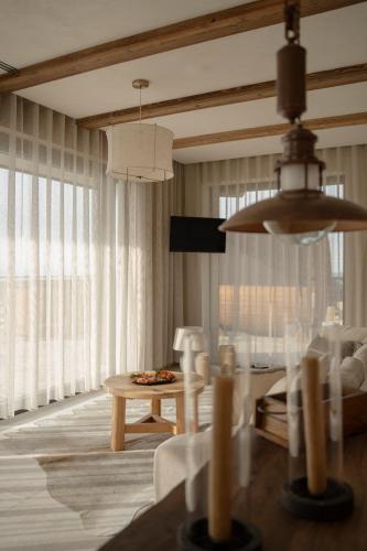 a living room with a couch and a table at Gorczański Lux Chalet in Szlembark