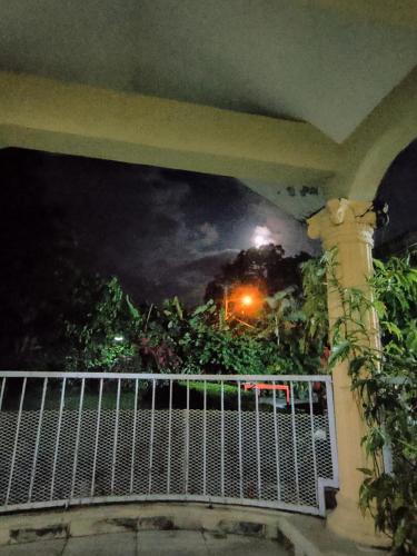 a balcony with a view of a night sky at Paraiso Hortensia Ecolodge in Santiago de los Caballeros