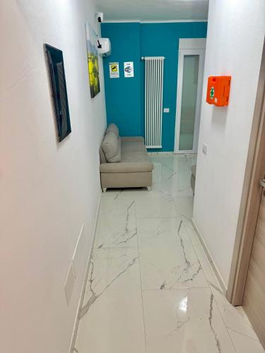 a room with a marble floor with a couch at Desire guest House in Pisa