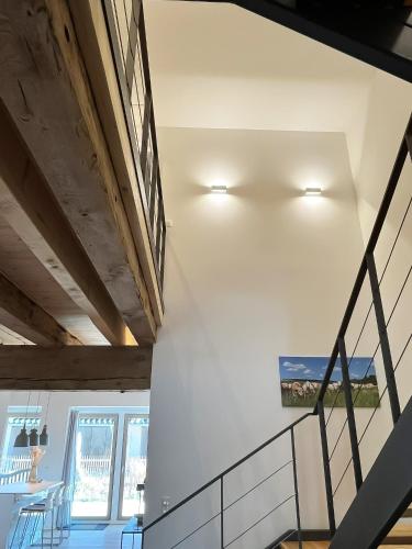 a staircase in a house with white walls at Landhaus Jarnitz in Ralswiek