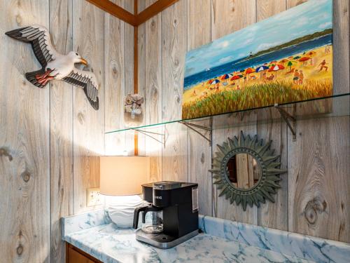 a bathroom with a coffee maker on a counter at Sea Gull Ocean Villa in Tybee Island