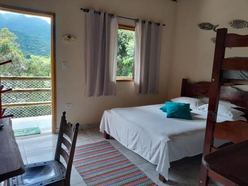 Ένα ή περισσότερα κρεβάτια σε δωμάτιο στο Ashtar Village - Pousada em Itamambuca