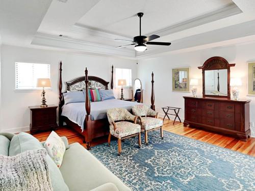 a living room with a bed and a couch at Oceanside Unit A in Tybee Island