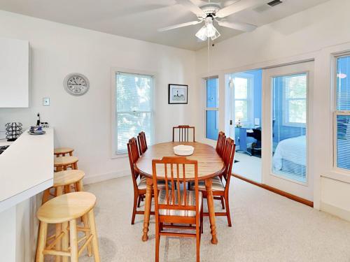 a kitchen and dining room with a table and chairs at Mercy Me in Tybee Island