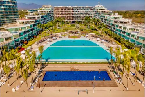 an aerial view of a resort with a swimming pool at Apartamento Luxury Nayarit vista al mar Mexico in Nuevo Vallarta 