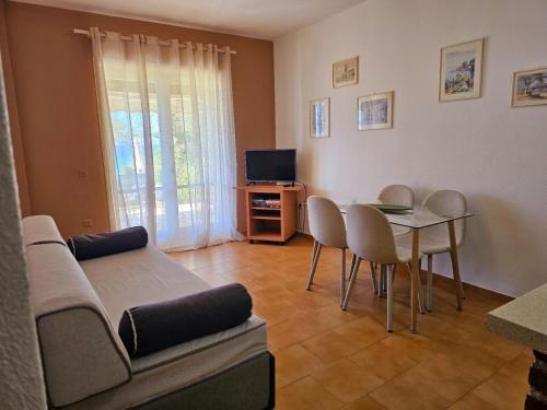 a living room with a couch and a table at Corfu Glyfada Beach Apartment 49 in Corfu