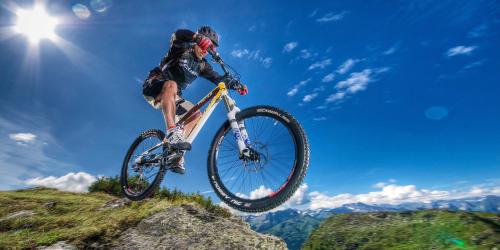 a man doing a trick on a bike in the air at Tenuta Il Burchio in Incisa in Valdarno