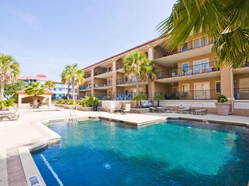 a large swimming pool in front of a building at Brass Rail 303 in Tybee Island