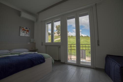 Postel nebo postele na pokoji v ubytování B&B La Castellana