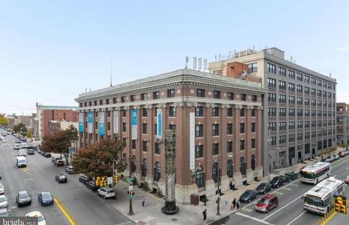 a large brick building on a city street with cars at Philadelphia Studio in Philadelphia