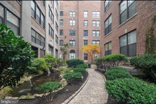 a walkway in front of a building with a creek at Philadelphia Studio in Philadelphia