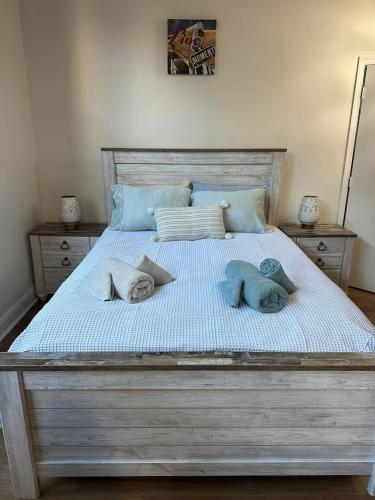 a large bed with two pillows on it at Philadelphia Studio in Philadelphia