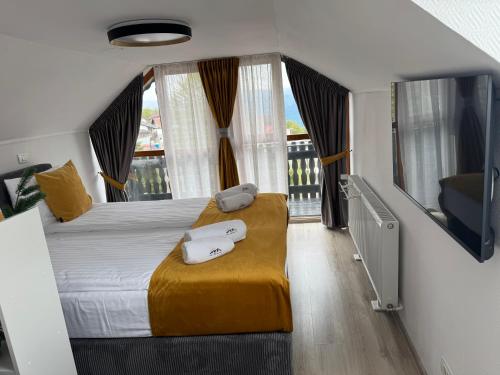 Giường trong phòng chung tại Casa Germana Straja