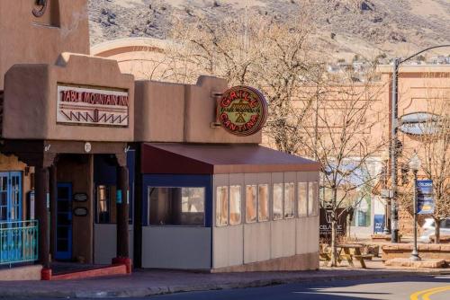 a restaurant with a sign on the side of a building at Golden Sanctuary Luxe Apt 1 Block From Main St in Golden
