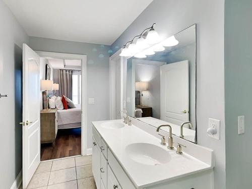a bathroom with a white sink and a mirror at Beach House 433 in Tybee Island