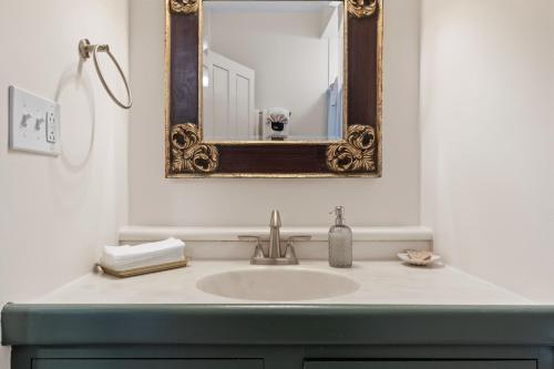 a bathroom with a sink and a mirror at Hartstone Inn in Camden