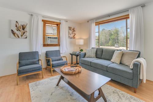 a living room with a couch and two chairs and a table at 16 Mi to Sleeping Bear Dunes Cedar Home with Deck in Cedar
