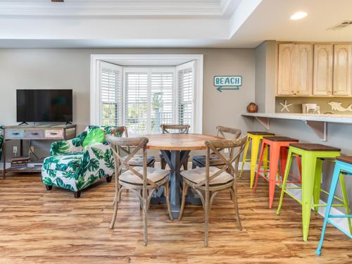 a dining room with a table and chairs at Bay View Villas 106 in Tybee Island