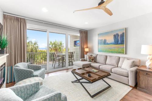 a living room with a couch and a table at Atlantic Ocean 2 in Tybee Island