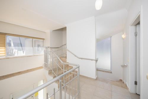 a staircase in a white room with a window at Villa Valley 5 in Oludeniz