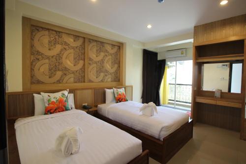Кровать или кровати в номере Monmuang
