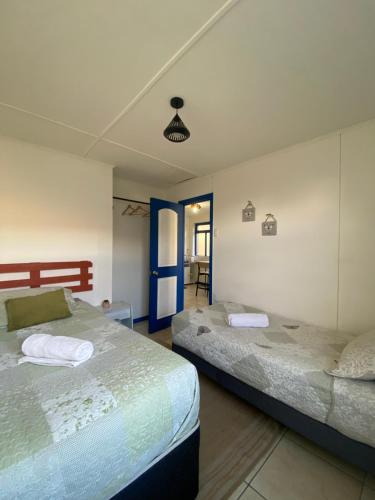 Postel nebo postele na pokoji v ubytování Lodging Incógnita, Punta Arenas