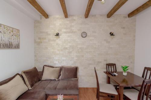 a living room with a couch and a table at Medo in Ulcinj