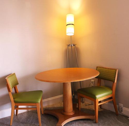 a table with two chairs and a light on top at Magic Key - Near Disney in Kissimmee