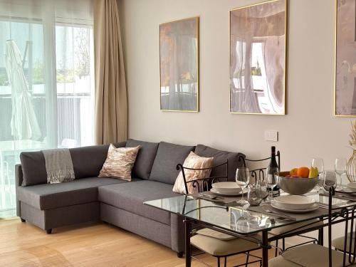 a living room with a couch and a table at Suite with Private Courtyard - Colosseum & Forum in Rome
